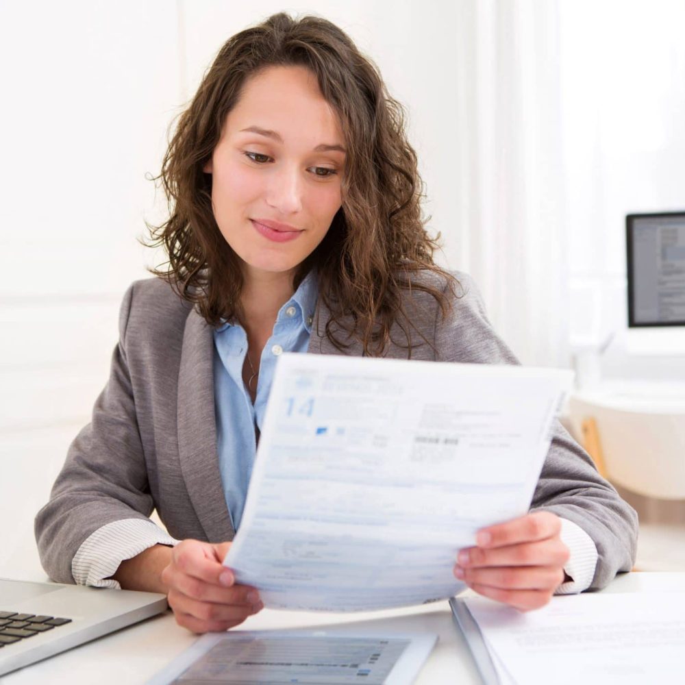 Woman reviewing rental tax income statement